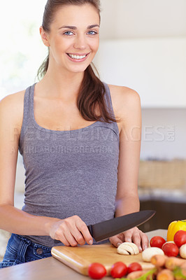 Buy stock photo Woman, portrait and happy with knife or vegetables for nutrition, cooking or healthy meal in kitchen of home. Person, face and chopping board with mushroom, tomato and carrots for wellness and diet