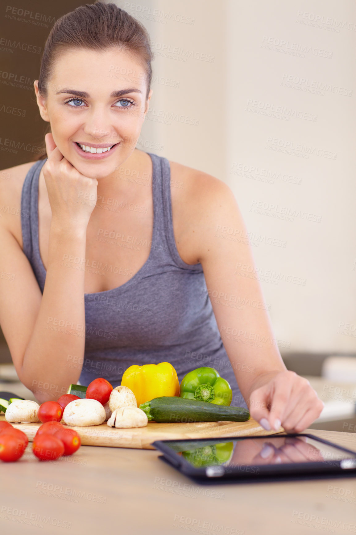 Buy stock photo Woman, thinking and smile with tablet or vegetables for nutrition, cooking or healthy meal in kitchen of home. Person, face or chopping board with mushroom, peppers and tomato for wellness and recipe