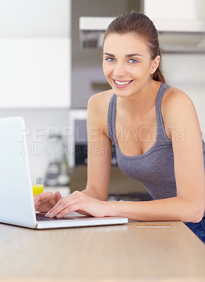 Buy stock photo Portrait, laptop and online shopping with a woman in the kitchen of her home for ecommerce in the morning. Computer, credit card and bank with a happy young person in an apartment for payment