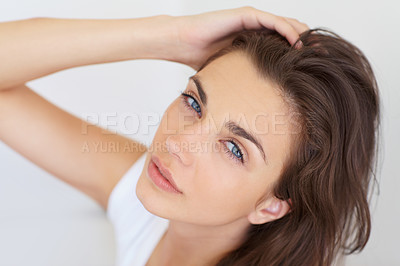 Buy stock photo Portrait, hair and cosmetics with a natural woman in studio on a white background for spa or wellness. Face, skincare and beauty with a confident young model at the salon for glow from above