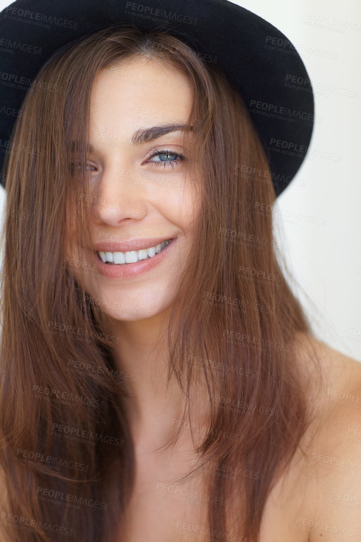 Buy stock photo Portrait, beauty and haircare with a young woman in studio on a white background for natural skincare. Face, aesthetic or wellness and a happy person looking confident in a trendy hat for style