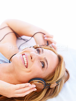 Buy stock photo Woman, headphones and music listening in studio for online streaming, floor fun or radio playlist. Female person, white background and audio hear for album happy or electronics, track for relax sound