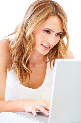 Buy stock photo Woman, laptop and studio typing or white background for online connection, working on floor. Female person, model and device for digital learning or social media blog project, research web or reading