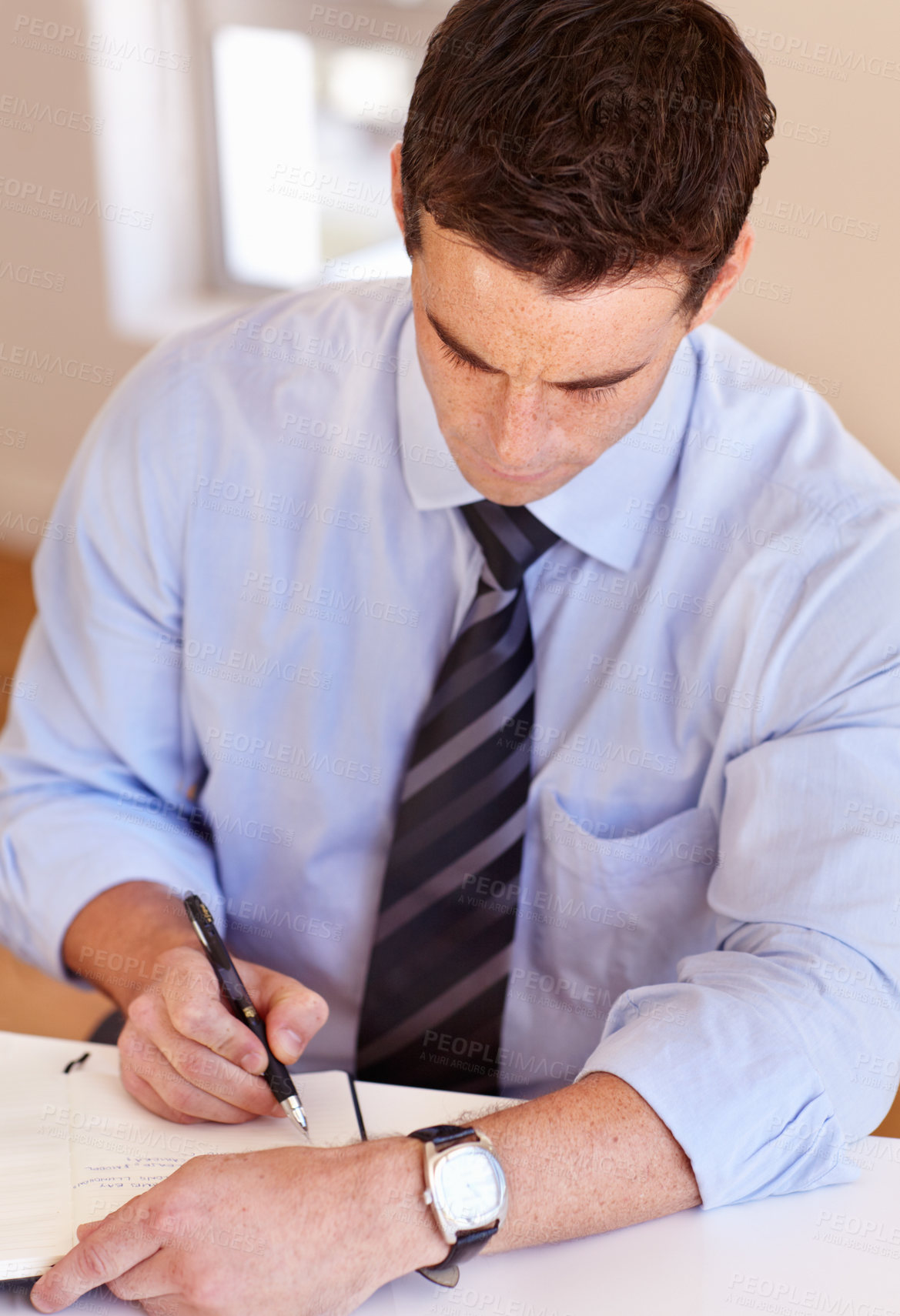 Buy stock photo Businessman at desk with pen, notebook and thinking for market research planning at startup. Office, notes and man writing schedule, agenda or to do list in book at agency with ideas for project.