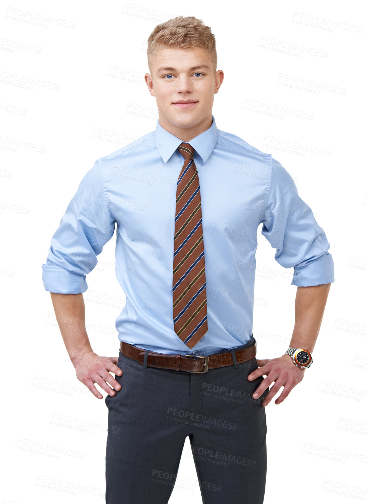 Buy stock photo A young businessman in a shirt and tie with his hands on his hips