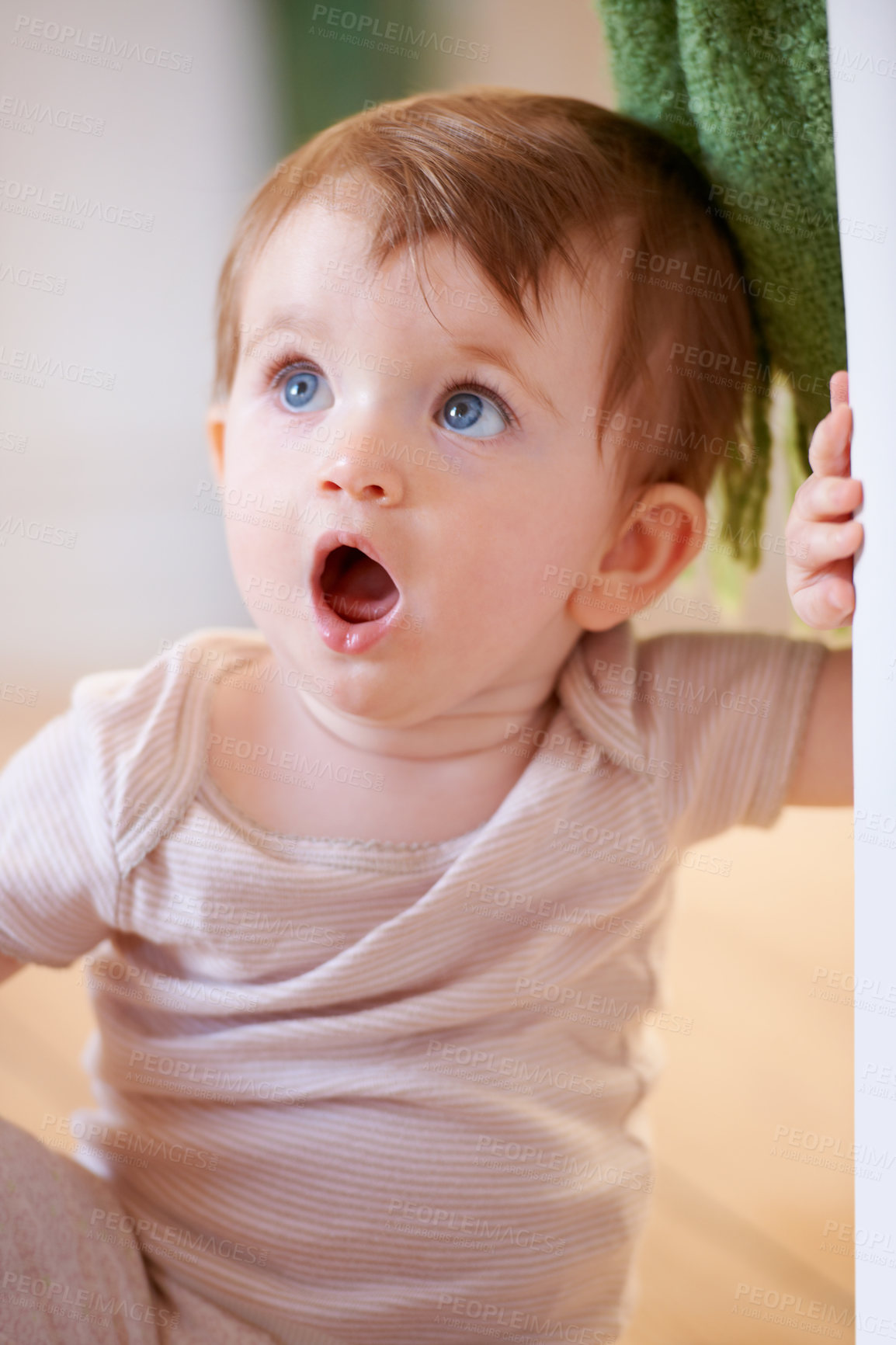 Buy stock photo An adorable little baby looking surprised