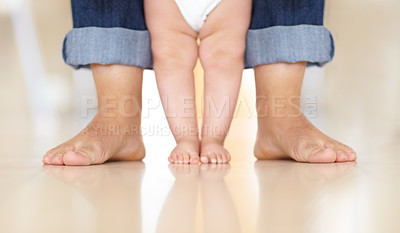 Buy stock photo Cropped image of a baby learning to walk