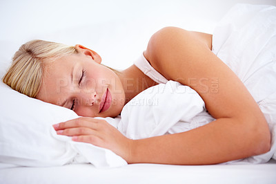 Buy stock photo Young woman sleeping comfortably on white linen