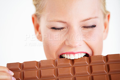 Buy stock photo Studio face, woman or eating chocolate bar, delicious snack or candy for unhealthy food, dessert or sugar product. Diet craving, calories or girl bite, taste or enjoy cacao sweets on white background