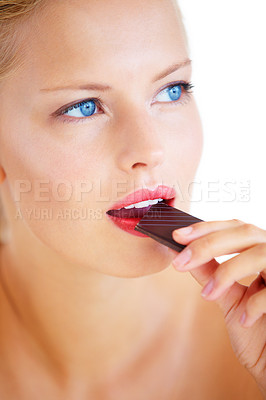 Buy stock photo Studio face, woman thinking or eating chocolate, cacao product or taste dessert snack, unhealthy junk food or candy. Wellness sweets, beauty or model brainstorming cheat meal plan on white background