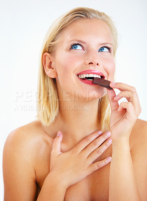 Buy stock photo Studio happiness, woman thinking and eating chocolate, delicious snack or look at sugar product, candy or dessert advertising. Antioxidants benefits, cacao sweets or wellness girl on white background
