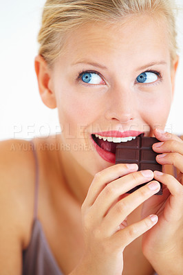 Buy stock photo Eating woman, face and thinking of dark chocolate benefits, antioxidants wellness or morning junk food, calories or tasty candy. Nutrition, delight and person enjoy sugar craving, cacao bar or sweets