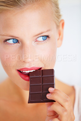 Buy stock photo Eating woman face, thinking and looking at dark chocolate benefits, antioxidants wellness or junk food. Craving solution, taste and girl planning sugar product, cacao bar or sweets advertising plan