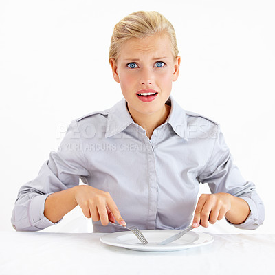 Buy stock photo Confused, hungry and woman with empty plate in studio with bored, upset or shock face. Surprise, frustrated and portrait of female person from Australia with dish and cutlery by white background.