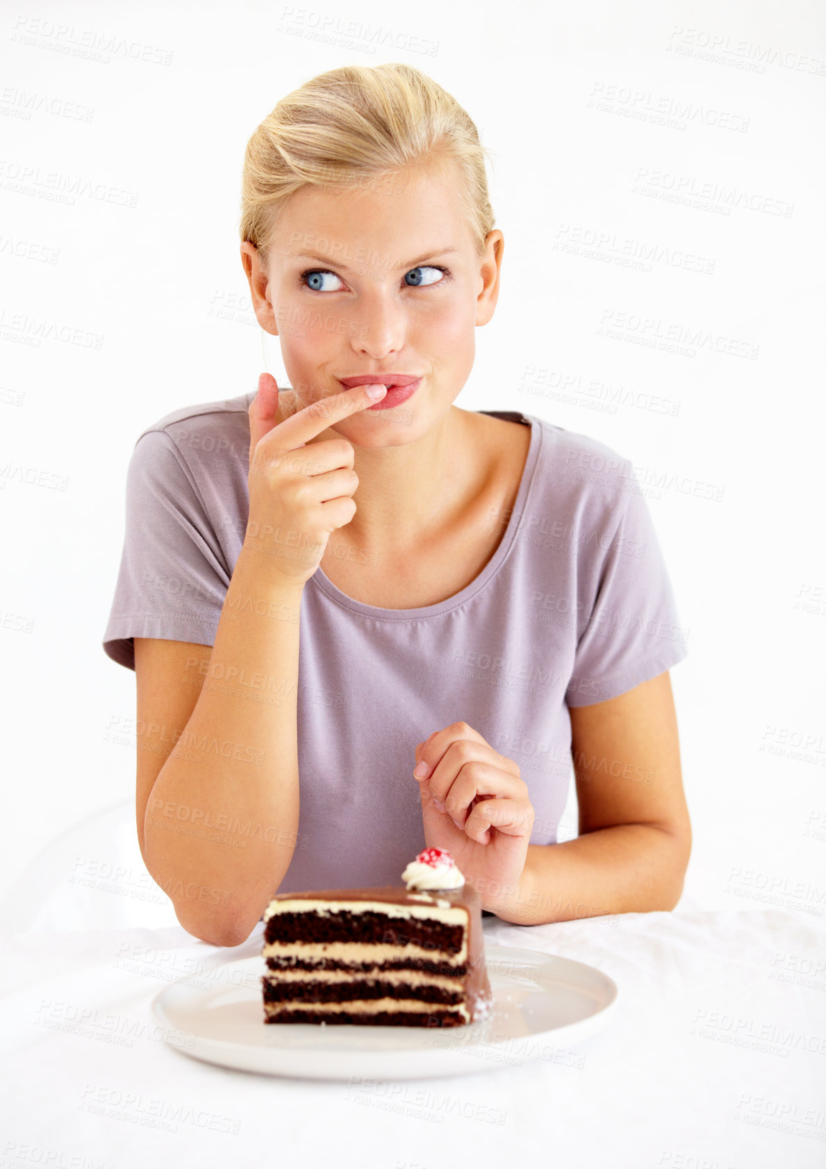 Buy stock photo Sneaky, cake and young woman in a studio cheating on healthy, wellness or weight loss diet. Yummy, sweet and female person from Australia eating a chocolate dessert isolated by white background.