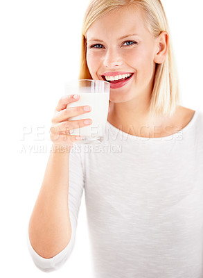 Buy stock photo Portrait, milk and smile with a woman drinking from a glass in studio isolated on a white background. Health, nutrition and calcium with a happy young female enjoying a drink for vitamins or minerals