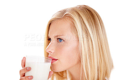 Buy stock photo Shot of a young woman enjoying a drink