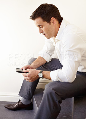Buy stock photo Business man, phone and stairs in office for reading, thinking and trading with crypto on application. Entrepreneur, investor and check smartphone for stock market, social network or fintech on steps