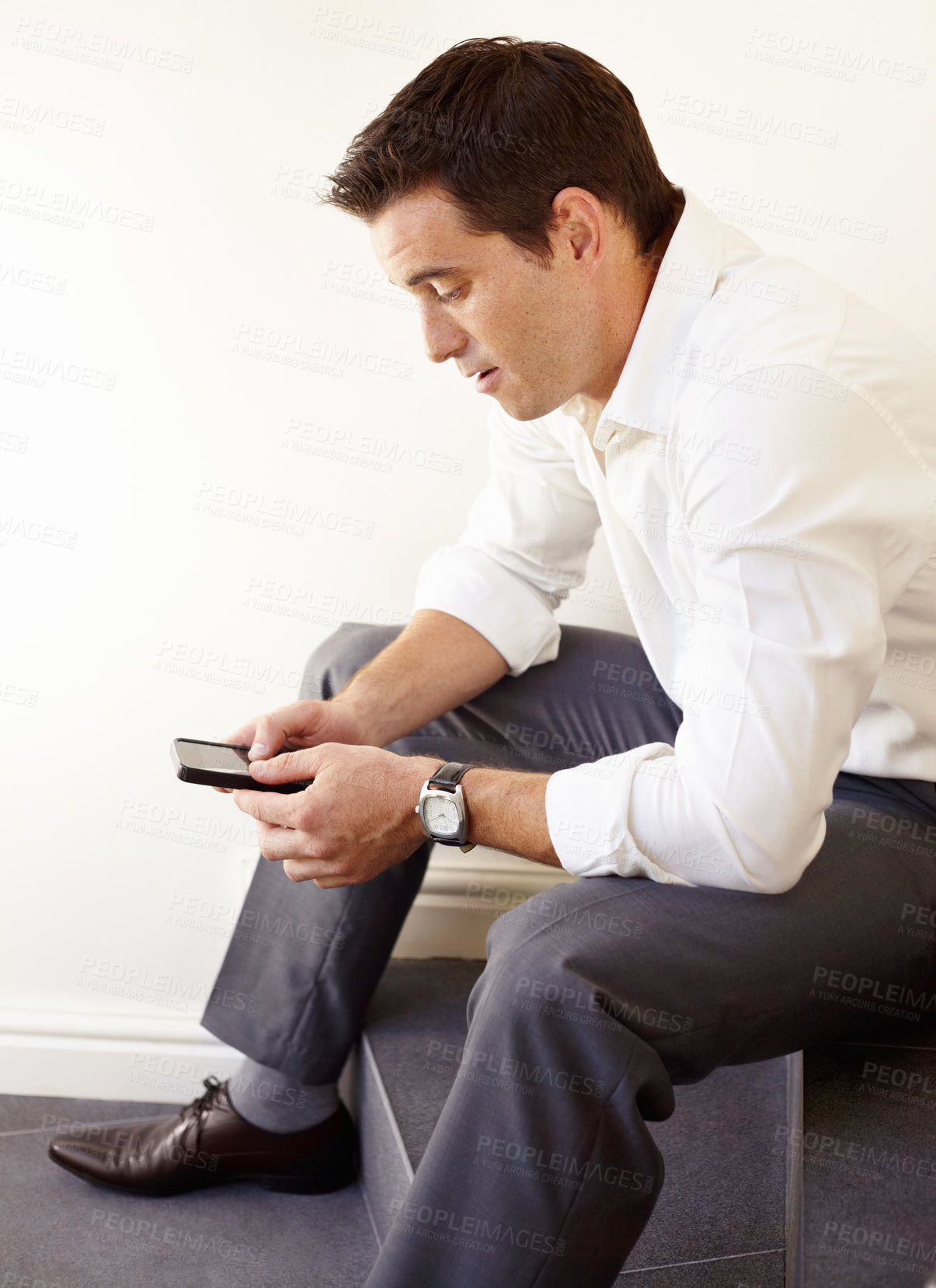 Buy stock photo Business man, phone and stairs in office for reading, thinking and trading with crypto on application. Entrepreneur, investor and check smartphone for stock market, social network or fintech on steps
