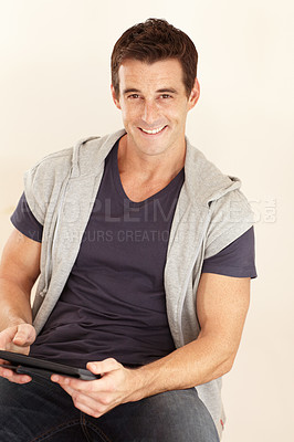 Buy stock photo Portrait, man and tablet in studio for social media, download news app and streaming multimedia on white background. Happy guy, digital technology and scroll for online shopping, subscription or blog