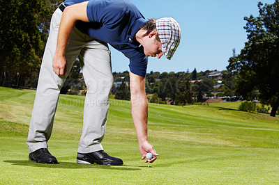 Buy stock photo Sports, golf tee and man on course playing game, practice and training for competition. Professional golfer, grass and person with ball and outdoor golfing club for stroke, tournament and score