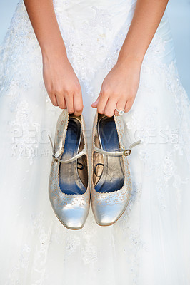 Buy stock photo Hands, wedding and closeup of a bride with shoes and dress for luxury, elegant and romantic event. Zoom of woman with silver, fashion and bridal heels and garments marriage ceremony or celebration. 