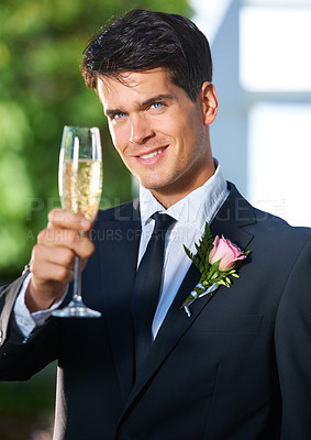 Buy stock photo Happy man, portrait and groom with glass of champagne for wedding toast, celebration or speech at outdoor ceremony. Face of handsome, attractive or married male person with alcohol or sparkling drink