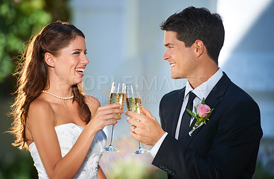 Buy stock photo Happy couple, wedding and cheers with champagne glasses in celebration for marriage, love or commitment. Married man and woman smile with alcohol for toast, date or honeymoon at outdoor ceremony