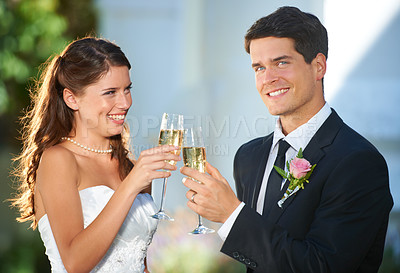Buy stock photo Happy couple, wedding and cheers with champagne in celebration for marriage, love or commitment. Married man and woman smile with glasses of alcohol for toast, date or honeymoon at outdoor ceremony