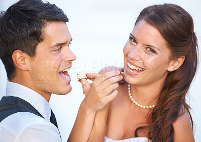 Buy stock photo Portrait, wedding cake and couple with smile, feeding and commitment celebration at luxury event together. Sharing dessert, eating and woman with man at marriage with tradition, loyalty and love.