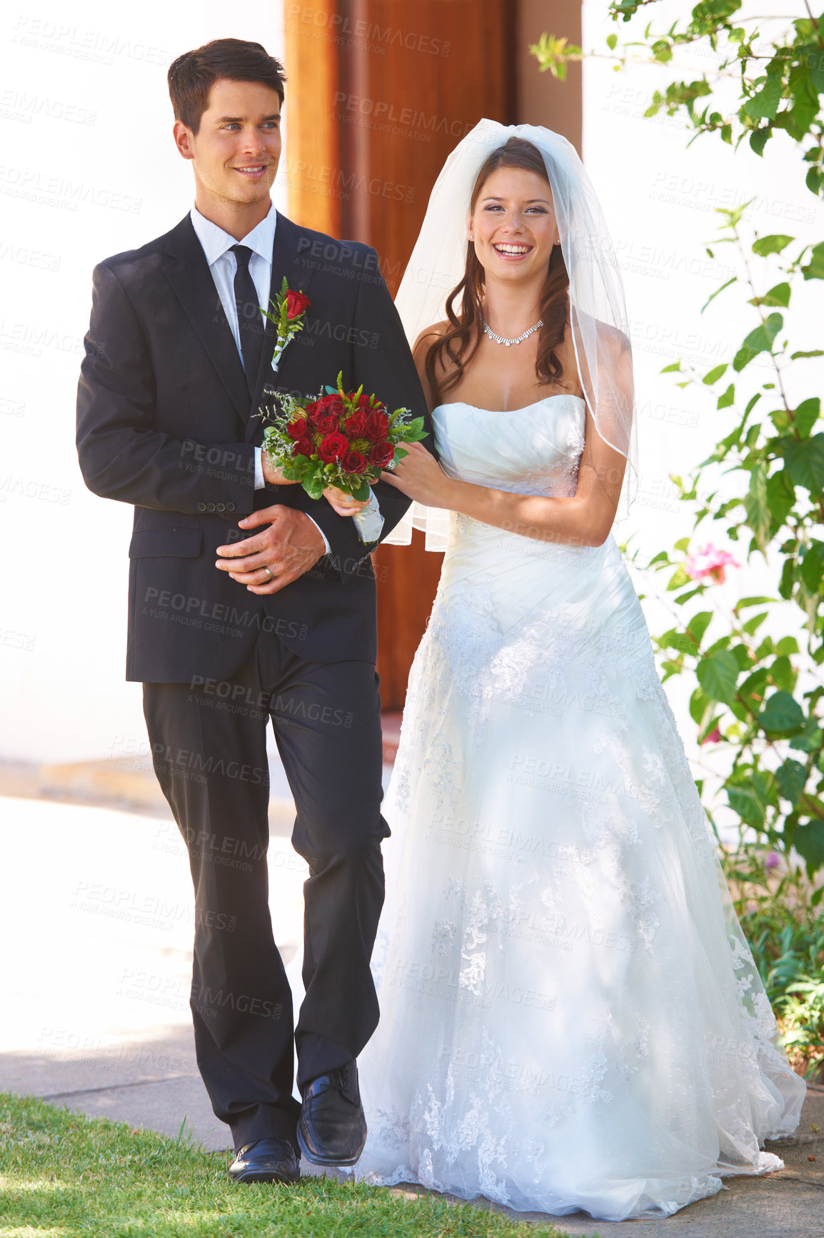 Buy stock photo Happy couple, wedding and holding hands with roses for marriage, love or outdoor commitment together. Married bride and groom walking with smile and bouquet of flowers at bridal event or ceremony