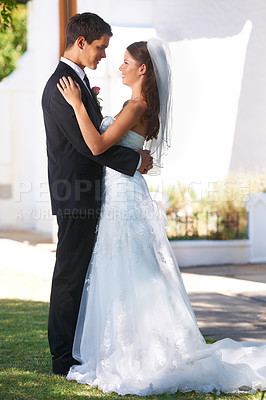 Buy stock photo Happy couple, wedding and hug or dancing at outdoor ceremony, reception or honeymoon together. Man or groom holding woman or bride smile for embrace, support or love in commitment or trust in garden