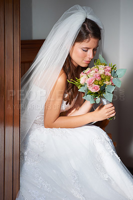 Buy stock photo Bride, woman and smelling a bouquet at wedding, ceremony or event for aroma, scent and happy in dress. Marriage, person and flowers or roses for commitment, love and new beginning with smile or joy