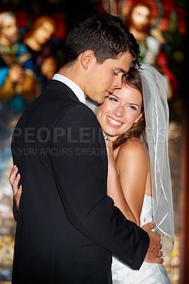 Buy stock photo Happy couple, hug and wedding at church for love, support or marriage together in commitment. Man hugging bride with smile for affection, loyalty and trust in married relationship at bridal ceremony