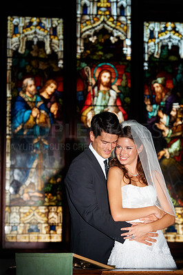 Buy stock photo Happy couple, hug and wedding at church for marriage, love or vow in commitment together. Married man or groom hugging woman or bride with smile for embrace, loyalty or support in trust at ceremony