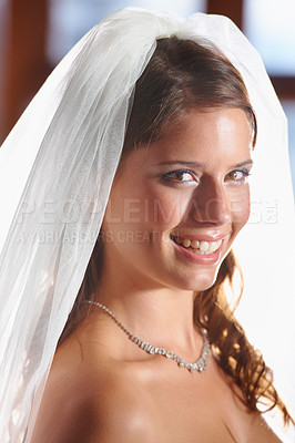 Buy stock photo Bride, portrait and smile for love, wedding commitment and celebration ceremony with a veil. Jewelry, woman and happy from future marriage, romance and formal event in a church with a bridal dress