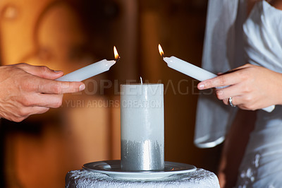 Buy stock photo Couple, hands and candle at wedding for love, unity and commitment at church or ceremony with closeup. Marriage, man and woman with light for trust, relationship and compromise with bride and groom
