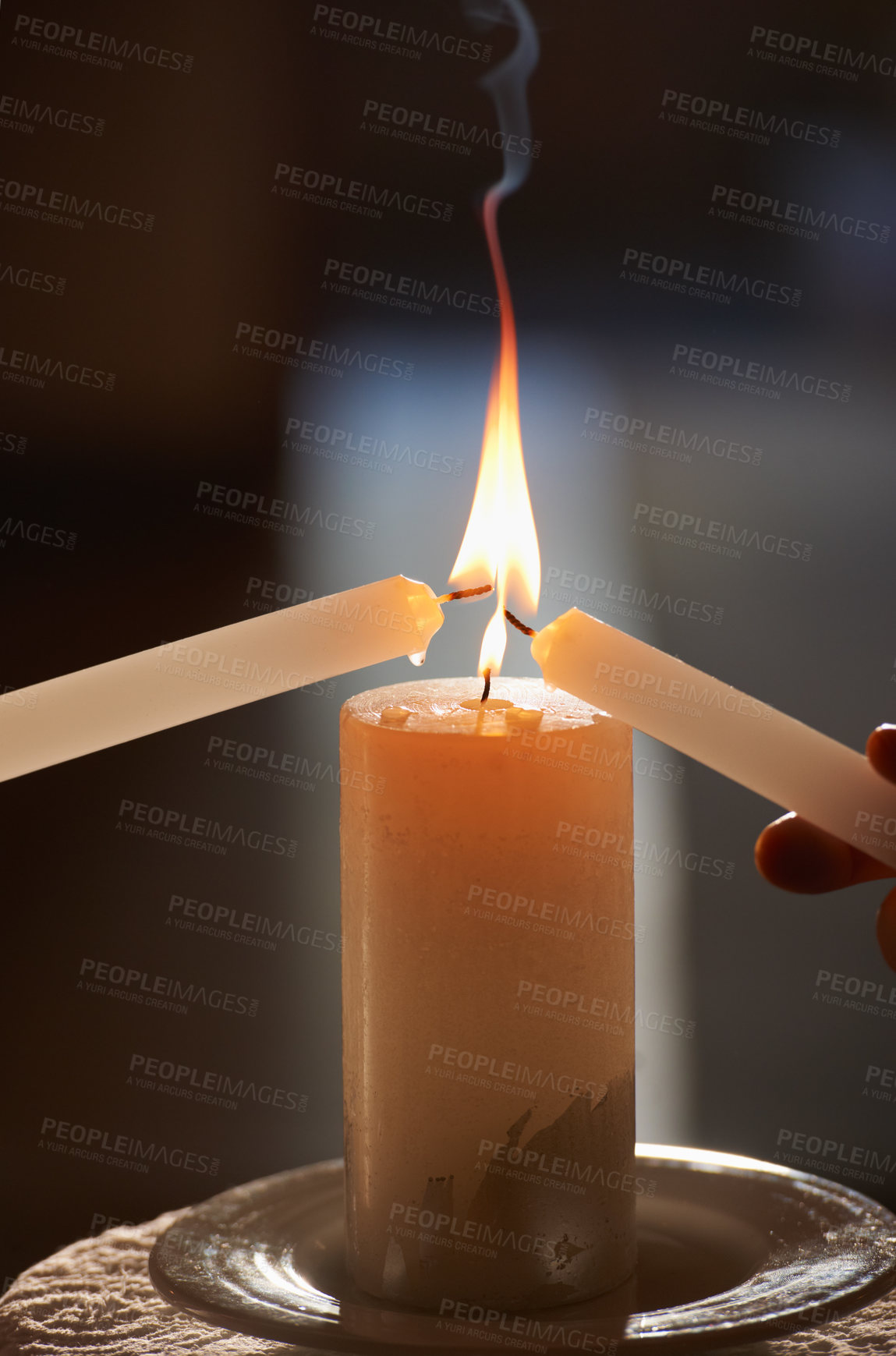 Buy stock photo Cropped closeup shot of a couple lighting candles during their wedding ceremony