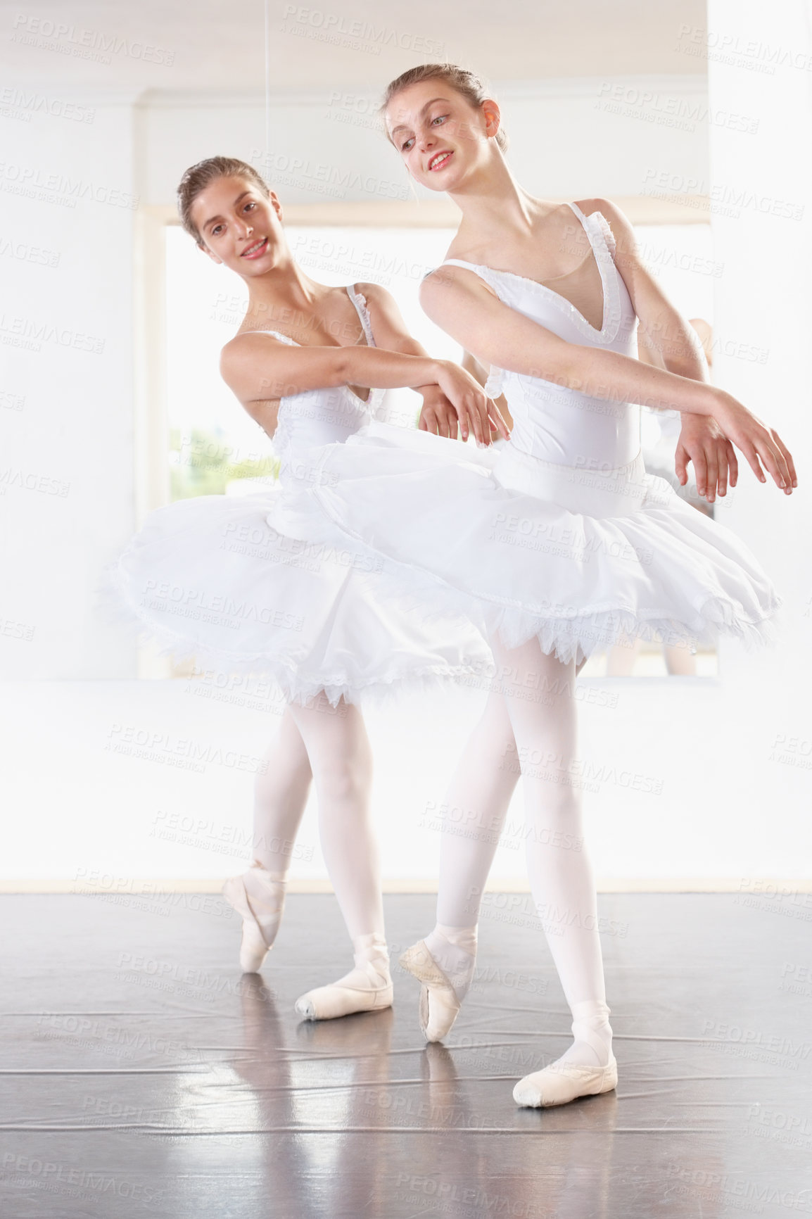 Buy stock photo Talent, dancing and students in ballet studio with pose, balance and performance class for teenager. Smile, art and young ballerina dancer with pride, confidence and creativity at learning academy.