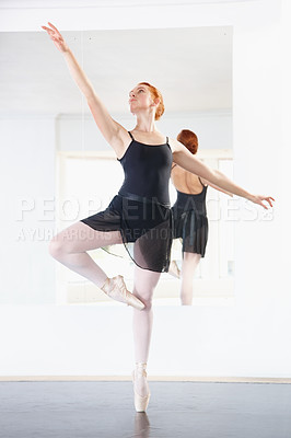 Buy stock photo Ballerina, woman and ballet class with dancing, young dancer in rehearsal with art and grace at studio. Female person in pointe pose, balance and training for performance with creativity and fitness