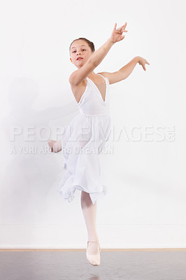 Buy stock photo Shot of a young ballerina practicing in a dance studio