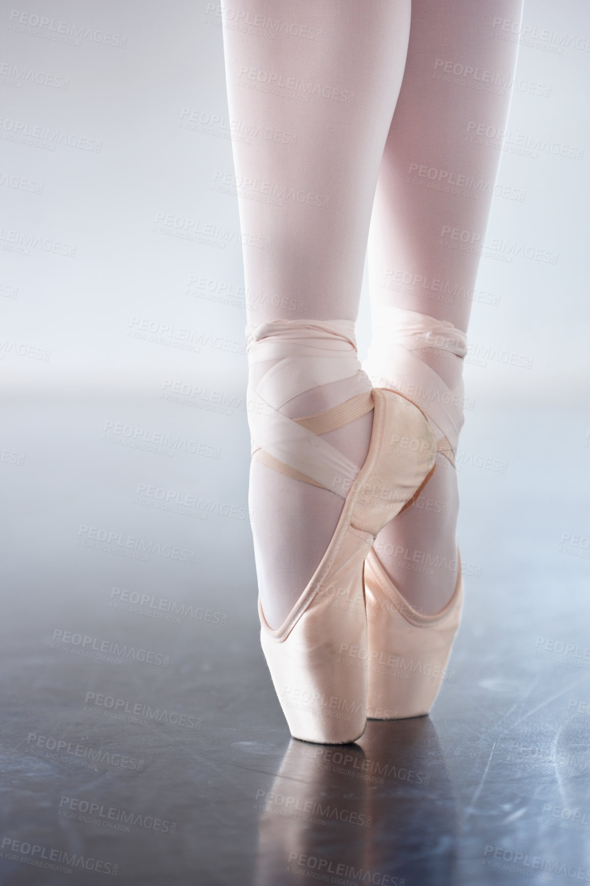 Buy stock photo Closeup, ballerina and feet with training, balance and creative dance art in a studio. Zoom, female performer and dancer with movement, shoes and ballet with workout, practice and performance routine