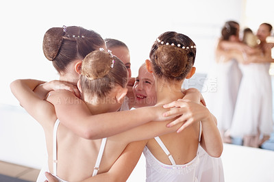 Buy stock photo Ballet, friends and hug or girl children smile and fun at dance studio or learn together. Happy, embrace and students in training or group celebrate at academy and young ballerinas or friendship