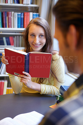 Buy stock photo Shot of a young man and woman studying together
