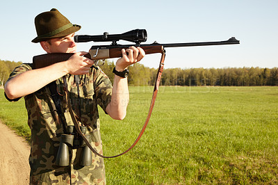 Buy stock photo Hunter, gun and man in nature on a Africa safari for animal shooting with a weapon on vacation. Hunting sport, male person and target hunt practise of a traveler in camouflage looking at a scope