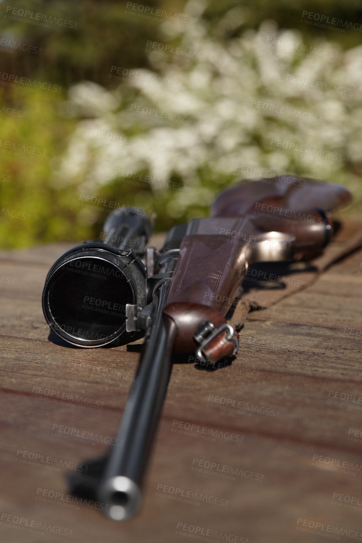 Buy stock photo Hunting, rifle and weapon with a gun on a table outdoor in nature on a game reserve or blurred background. Sports, scope and sniper with hunter or military equipment on a wooden surface outside