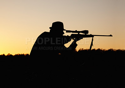 Buy stock photo Hunting, sunset, man with gun and focus on target in nature to hunt game for sport on safari adventure. Sky, silhouette and hunter with rifle in bush, setting sun and shooting hobby on summer evening