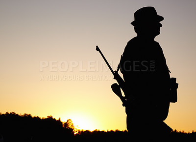 Buy stock photo Hunting at sunset, man with rifle and mockup in nature to hunt game for sport hobby on safari adventure. African sky, silhouette and mock up space, hunter with gun in bush and evening setting sun.