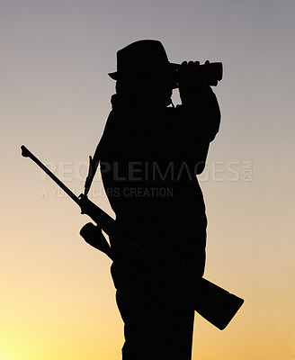 Buy stock photo Hunting at sunset, man with gun and binoculars in nature to hunt game for sport on safari adventure. Sky, silhouette and hunter with rifle, search and setting sun for shooting hobby on summer evening