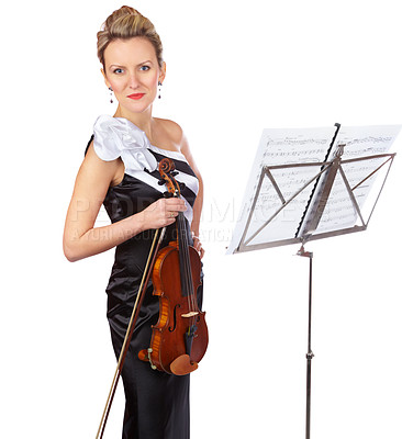 Buy stock photo A gorgeous violinist standing in front of a sheet music stand - portrait